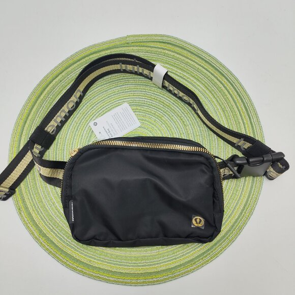 lululemon athletica Handbags - Lululemon Everywhere Crossbody Belt Bag Wordmark Black and Gold Logo